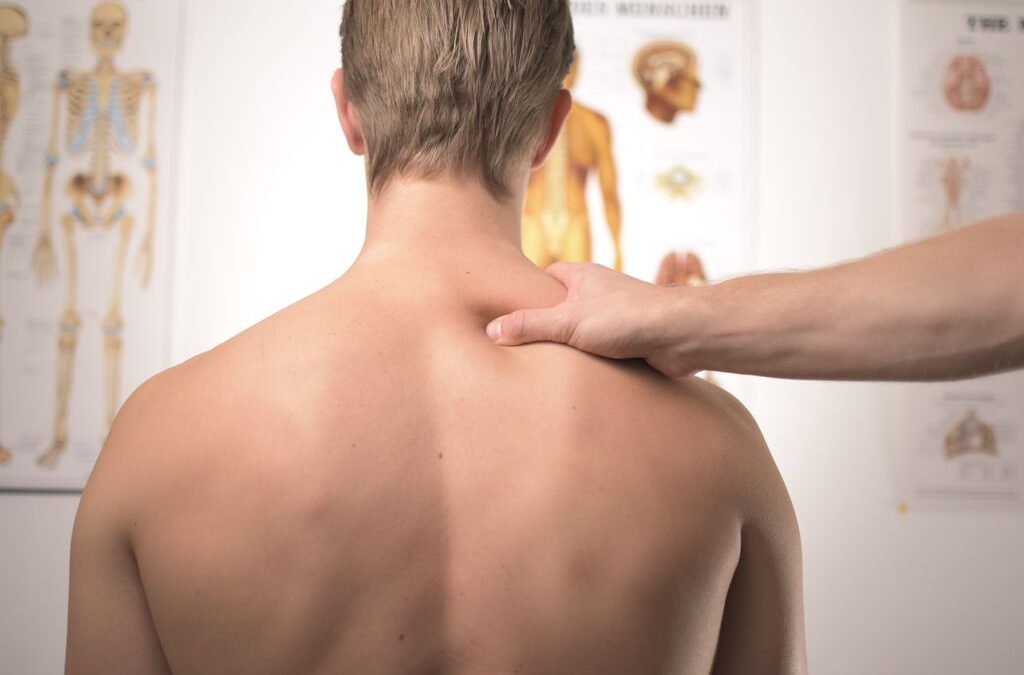 a man getting treatment on their back by a chiropractor