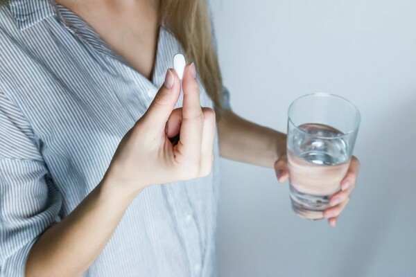 a women taking a placebo, an important part of research